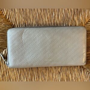 Fossil Leather zip around wallet with pink lining card slots and coin section